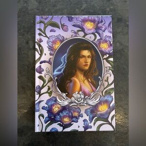 The bookish box Warbride Book with Purple and Gold Cover